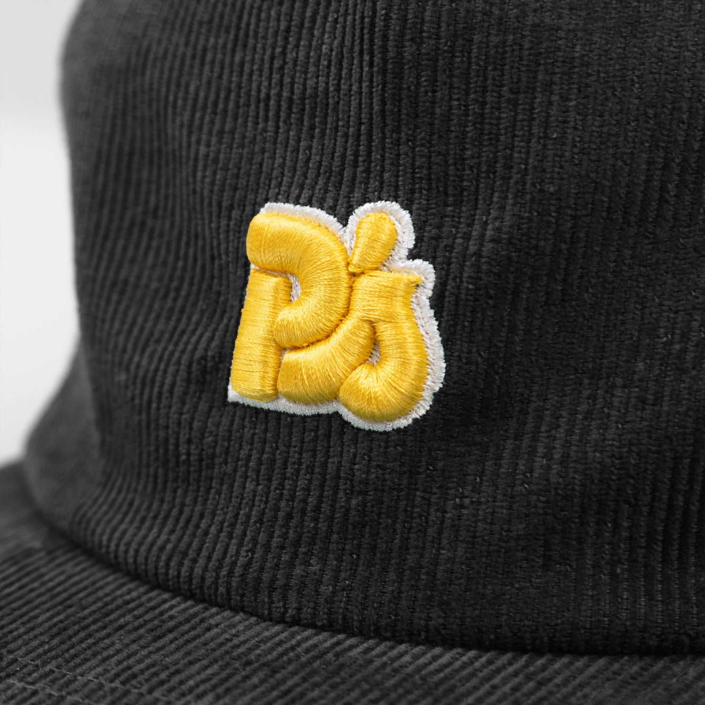 PARKER’S P”S CORDUROY HAT IN BLACK